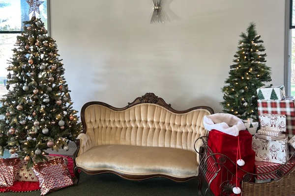 Holiday decorations with Christmas trees and a vintage sofa at Timber Ridge Golf Course
