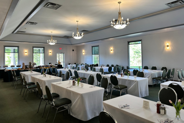 Banquet room at Timber Ridge Golf Course set with tables for a private event